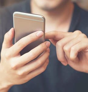 Man scrolling smartphone